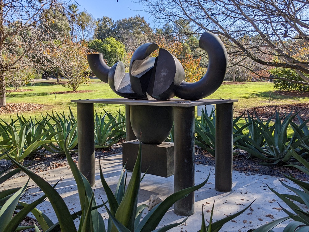 Firestone, by Peter Voulkos - a  substantial abstract expressionist sculpture of bronze and aluminum, surrounded by agaves