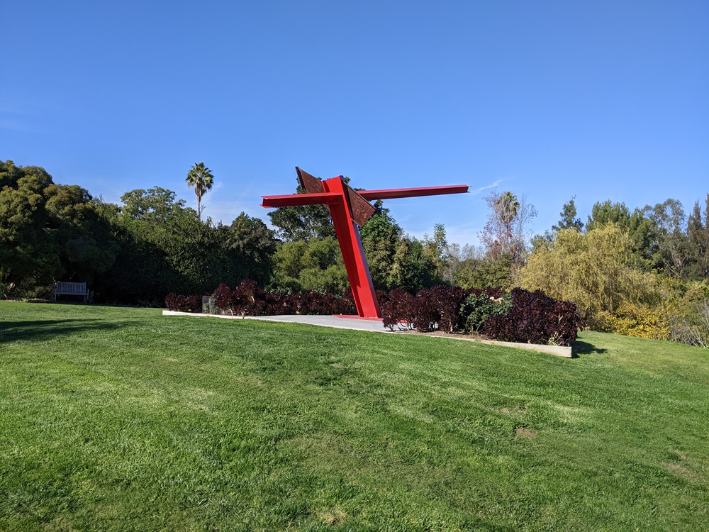 Teha, by Mark di Suvero - an abstract expressionist sculpture made of red industrial beams