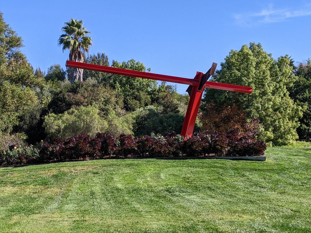 Teha, by Mark di Suvero - an abstract expressionist sculpture made of red industrial beams